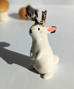 jackalope figurine with golden antlers