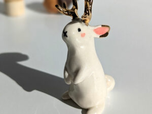 jackalope figurine with golden antlers