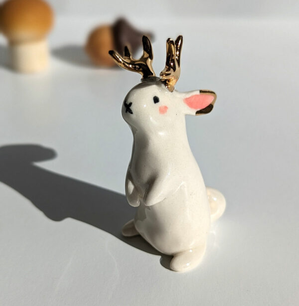 jackalope figurine with golden antlers