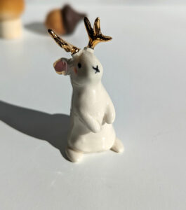 jackalope figurine with golden antlers
