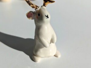 jackalope figurine with golden antlers