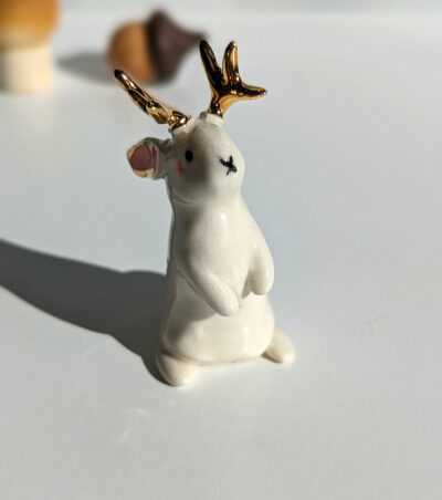 jackalope figurine with golden antlers