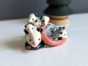 cute opossum family porcelain sculpture
