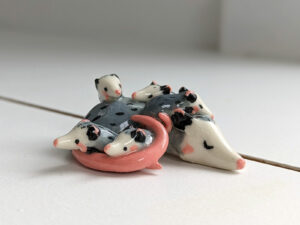 extremely cute opossum mama figurine sleeping with babies - kness