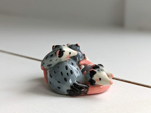 extremely cute opossum mama figurine sleeping with babies - kness