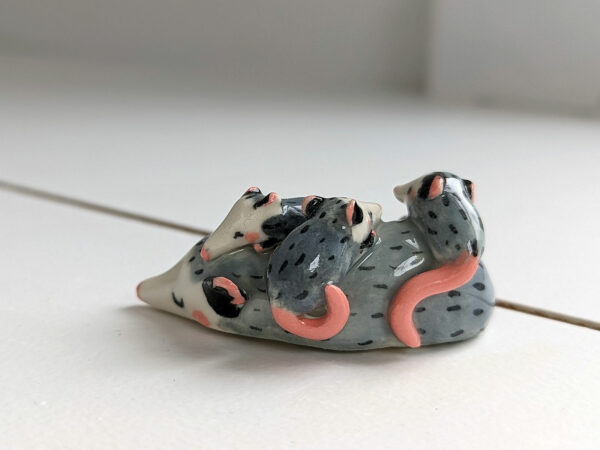 extremely cute opossum mama figurine sleeping with babies - kness
