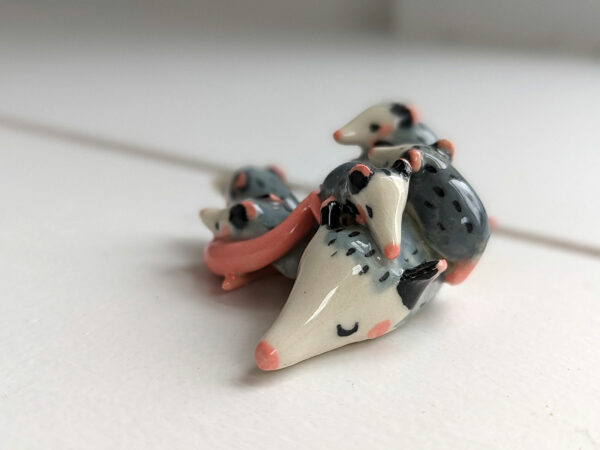 extremely cute opossum mama figurine sleeping with babies - kness