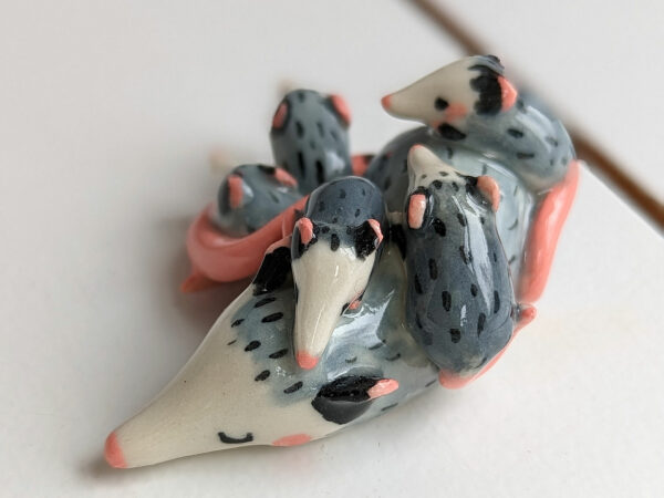 extremely cute opossum mama figurine sleeping with babies - kness