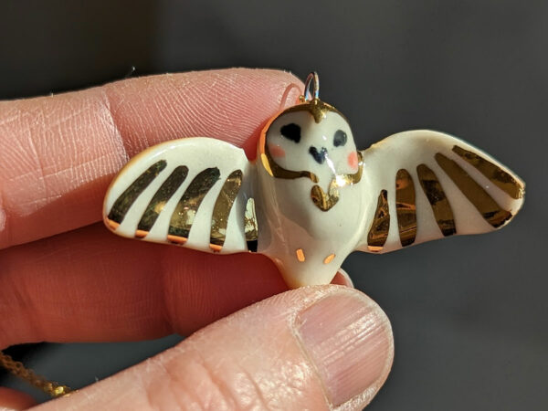 cute handmade porcelain barn owl pendant with wings out and gold