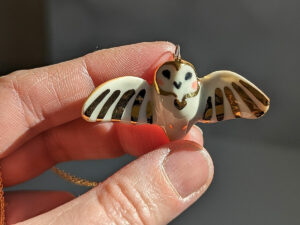 cute handmade porcelain barn owl pendant with wings out and gold