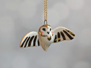 cute handmade porcelain barn owl pendant with wings out and gold