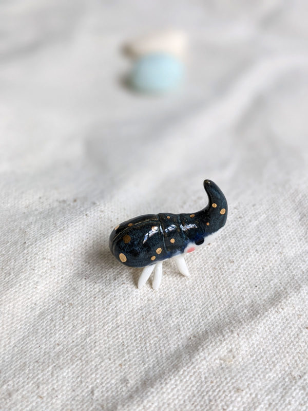 porcelain beetle figurine