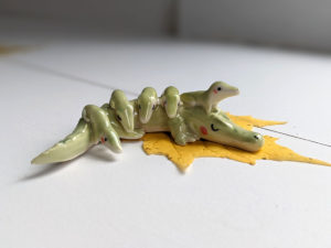 porcelain crocodile mama figurine