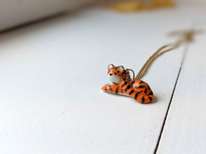 porcelain pendant lying tiger