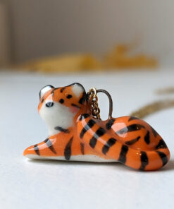 porcelain pendant lying tiger