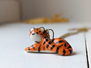 porcelain pendant lying tiger