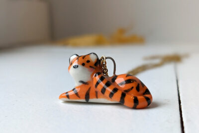 porcelain pendant lying tiger