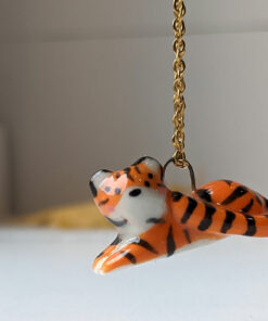 porcelain pendant lying tiger