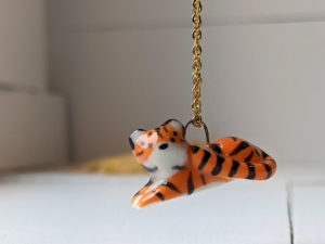 porcelain pendant lying tiger