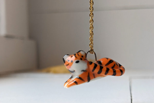 porcelain pendant lying tiger
