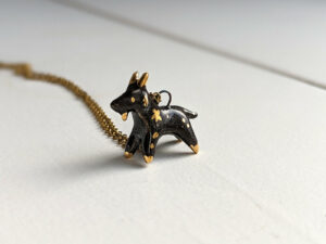 Black Phillip porcelain pendant with gold