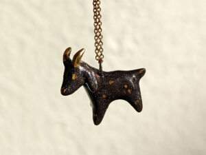 Black Phillip porcelain pendant with gold