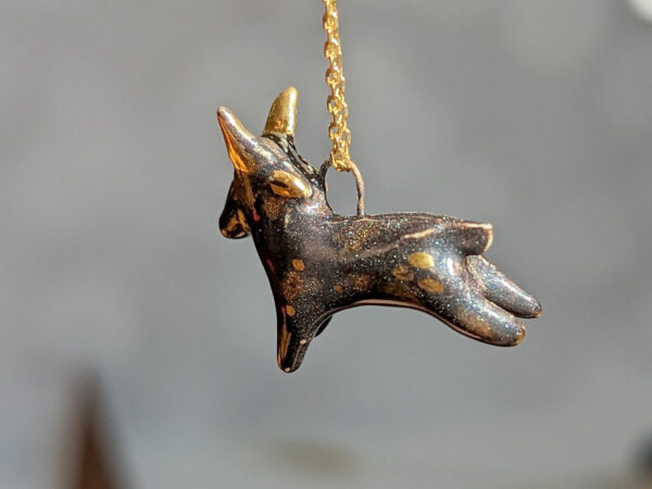 Black Phillip porcelain pendant with gold