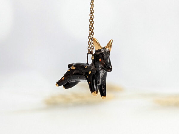 Black Phillip porcelain pendant with gold