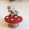 snow leopard tail eating pendant porcelain kness