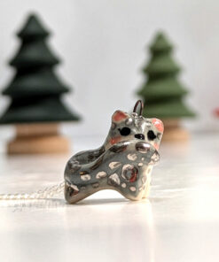 adorable snow leopard pendant tail in mouth