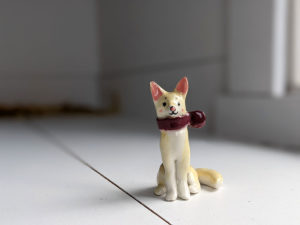 dog scarf porcelain figurine