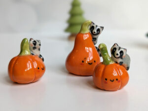 pumpkin raccoon figurine