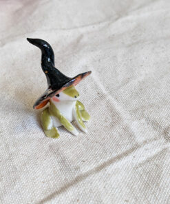 porcelain witch frog figurine