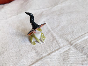 porcelain witch frog figurine