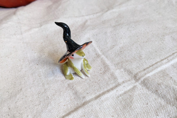 porcelain witch frog figurine