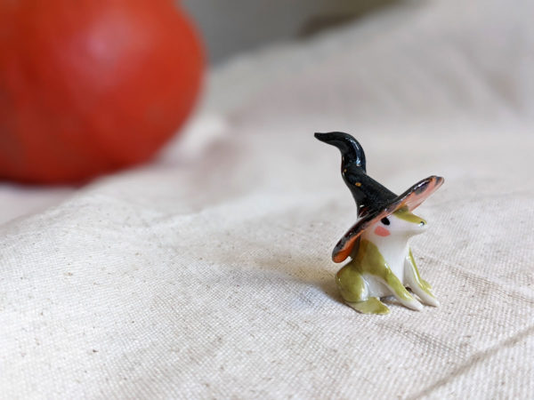 porcelain witch frog figurine