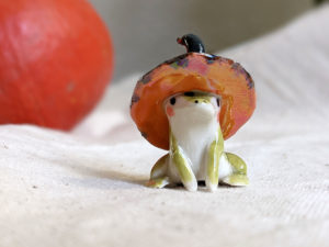 porcelain witch frog figurine