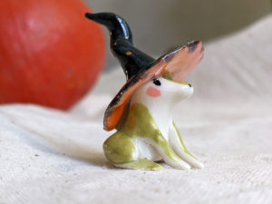porcelain witch frog figurine
