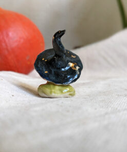 porcelain witch frog figurine