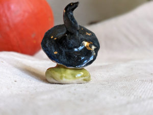 porcelain witch frog figurine