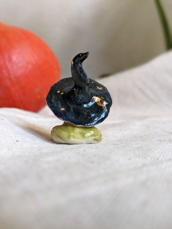 porcelain witch frog figurine