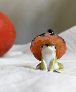 porcelain witch frog figurine