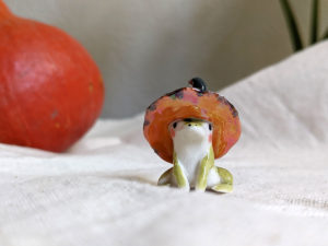 porcelain witch frog figurine