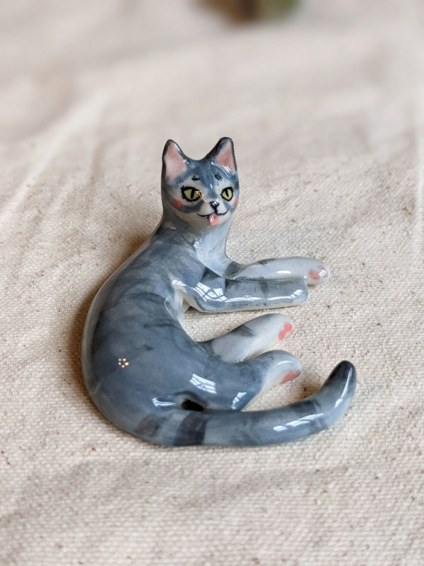 porcelain cat figurine grey tabby tongue out