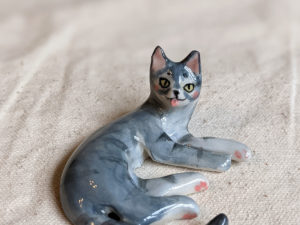 porcelain cat figurine grey tabby tongue out