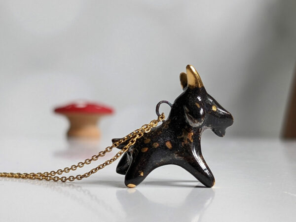 Black Phillip porcelain pendant with gold