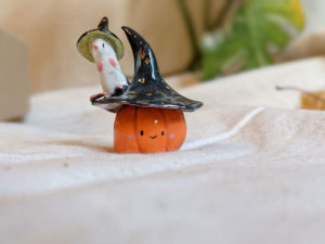 Pumpkin figurine and a witch