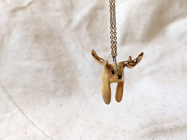 lop bunny pendant with golden antlers