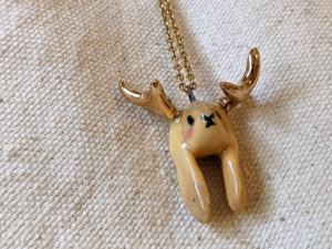 lop bunny pendant with golden antlers