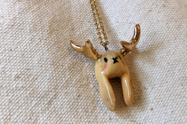 lop bunny pendant with golden antlers